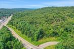 Nestled in the heart of Mohegan Lake, this 1.62-acre parcel offers a rare opportunity to build your dream home with approved building plans already in place. The land is fully equipped with utilities, including water, electricity, and gas connections, making it a turnkey option for those looking to create a custom home in a sought-after location.Key Features:- Approved building plans for a custom home- Utilities already set up (water, electricity, gas)- Convenient location with quick access to major highways- Quiet and private setting, ideal for residential livingLocated in the desirable Westchester County town of Mohegan Lake, this property offers an ideal blend of serenity and convenience. Situated just moments from Bear Mountain Parkway and the Taconic State Parkway, commuting to nearby cities and towns is a breeze. The proximity to these major roadways ensures easy access to the greater Westchester area, as well as quick connections to NYC and the surrounding suburbs.Area Highlights:Shopping & Dining: The nearby Cortlandt Town Center is a major retail hub featuring Walmart, The Home Depot, Best Buy, Barnes & Noble, and several dining options including Applebeeâ€™s, Panera Bread, and Five Guys. Additionally, local markets and eateries are available in Mohegan Lakeâ€™s charming downtown.Education: The property falls within the Lakeland Central School District, which includes George Washington Elementary School, Lakeland-Copper Beech Middle School, and Lakeland High School. Private schools, such as St. Elizabeth Ann Seton School in Shrub Oak, are also within reach.Parks & Recreation: Enjoy outdoor activities at nearby FDR State Park, which offers hiking trails, picnic areas, and a pool. The landâ€™s location near Junior Lake & Pool and Downing Park ensures ample opportunities for family-friendly fun and relaxation.Community & Lifestyle: Mohegan Lake is known for its welcoming, family-friendly environment with a strong sense of community. Whether you&rsquo;re looking for a peaceful place to call home or a strategic location close to all amenities, this area offers the perfect blend of comfort and convenience.Transportation:Bear Mountain Parkway: The property offers quick access to Bear Mountain Parkway, providing connections to major roadways in the area.Taconic State Parkway: A short drive away, the Taconic State Parkway offers an easy route to other parts of Westchester County and beyond, ideal for commuters.This land is ready for you to begin construction on your dream home. Whether you&rsquo;re looking to create a private retreat or a spacious family home, the possibilities are endless here.