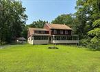 LARGE TWO STORY HOME AND COTTAGE ON FIVE ACRES/WALLKILL SCHOOLS - Looking for a project? This is the one! With the possibility of sub-division, this large parcel with home, cottage and two car detached garage with electric is perfect for someone with a vision. The main home features a kitchen, gigantic dining room perfect for gatherings and a living room adorned with wood beams. The main floor also features a full bathroom with walk-in shower as well as a convenient main-level bedroom. Upstairs you&rsquo;ll find five additional bedrooms, another full bathroom and a convenient summer kitchen. Plus there&rsquo;s a walk-up attic offering loads of storage space. This 1880&rsquo;s home is brimming with old-world charm. The property is surrounded by an abundance of mature trees, including majestic black walnuts, offering both privacy and natural beauty. With plenty of space for gardens and outdoor entertaining, it&rsquo;s the perfect spot to enjoy the outdoors. There are two enclosed porches on the front of the house, each filled with natural light, creating a bright and inviting space to relax. This home is in a fabulous commuter location with only minutes to I-84 and the Thruway and just 10 miles to the Newburgh/Beacon Bridge for easy access to the Metro North Train Station into NYC. Home is being sold AS-IS and is a CASH SALE only.