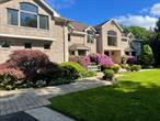 *527 Split Rock Road is a beautiful custom-built brick and stucco Colonial home set on 2 professionally landscaped, tranquil acres in the Syosset SD. Situated on a private road (off Split Rock Rd), the park-like lush property boasts a 250&rsquo; driveway in a serene, private quiet setting. This approximately 5500 sq. ft house is set between the shops of downtown Syosset and the waterfront of Oyster Bay. The property is phenomenal, a year-round wonderland that offers spectacular sunrises in the backyard -- and picturesque sunsets glowing over the front lawn. Designed with an open floor plan, the heart of the house features a spacious country kitchen complete with Sub-zero refrigerator and high-end appliances, plus an adjacent multi-windowed dining area overlooking the stunning property. First floor includes formal dining room, bedroom, full bath, living room, grand foyer with soaring ceilings and sweeping staircase, den with cozy fireplace, luxurious powder room, laundry room and convenient back staircase for easy access to second floor. The second floor features a tremendous 2nd family room and additional room with French doors, perfect for another bedroom or office. 4 second level bedrooms include an expansive primary with a private balcony overlooking the grounds. This serene retreat includes a sitting area, dressing area, walk-in-closets and elegant, oversized, ensuite bath with soaking tub and spacious shower. 3 additional bedrooms share 2 well-appointed baths. The home features custom moldings, pristine hardwood floors and bespoke closets. The resort-like property features a spectacular 44&rsquo;x22&rsquo; saltwater, heated, gunite swimming pool with automatic retractable pool cover, expansive paver patios, lush specimen plantings, covered pergola BBQ area and additional deck off the kitchen/den. Unfinished basement with walk-out steps awaiting your design. The home is in the coveted Syosset School District, including Berry Hill Elementary School.