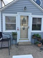 Charming Cottage on a Quiet One-Way Street! Nestled just steps from local restaurants, shops, banks, and the beach, this cozy cottage offers the perfect blend of comfort and convenience. Inside, youâ€™ll find two inviting bedrooms, a fully renovated bathroom, an updated kitchen with stainless steel appliances, a washer/dryer, and a bright living room. Outside, enjoy a private, fenced-in yardâ€”ideal for relaxing or entertaining.Whether you&rsquo;re looking for a year-round residence or a perfect summer getaway, this home has it all!