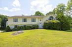 Massive Fishkill raised ranch perfectly situated on 1.43 acre parcel. Versatile floor plan features main level living room w/cathedral ceiling and fireplace, which flows seamlessly to formal dining room w/cathedral ceiling & spacious sunroom. Huge eat-in kitchen w/center island, two pantries and deck access. Large master bedroom suite includes two walk-in closets & ensuite bathroom with jetted tub. Two additional main level bedrooms & full bathroom. Lower level includes spacious family room with patio access, bedroom w/walk-in closet, third full bathroom, office/den w/patio access, storage room & laundry room. Oversized two car garage for abundant storage. Enjoy the conveniences of central a/c, 20 kw backup generator and solar panels for energy efficient operating costs. A truly unique floor plan with well proportioned rooms throughout. Expansive backyard for outdoor enjoyment. Conveniently located just minutes from Route 52, Taconic State Parkway, I84, shopping, dining & schools. The perfect place to entertain or raise a family. Estate sale being sold as-is.