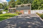 Outstanding curb appeal from this move-in-ready home on a quiet country lane. Featuring Hardwood floors, brick wood burning fireplace with raised hearth, updated roof, siding with lighted soffits, trex deck, large paver patio. Completely private backyard ideal for entertaining or just relaxing in nature. Up the stone steps to a 2nd tier of vast claimable land for future creations e.g. pool, recreation.  Steel I beam construction. Generous .33 lot. Ideal location which is close to shopping, restaurants, entertainment, highways and the LIRR.