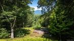 Catskills Retreat â€” Nearly 34 Acres, Minutes from Woodstock & SaugertiesThis exceptional property offers just under 34 acres across two parcels, with sweeping mountain views, a meandering stream, and remarkable privacy â€” all 8 minutes to the center of Woodstock, 12 minutes to the town of Saugerties, and only minutes from the world-famous Opus 40 sculpture park.A roughed-in driveway extends to the top of the property where panoramic overlook views unfold. The land is ready to build â€” electricity is on-site and a Health Department-approved septic system for a 4-bedroom home is already planned out. A cleared mountaintop area provides the perfect spot for your future home, surrounded by nature&rsquo;s beauty.The lower portion of the property features a tranquil stream and lush meadows, ideal for exploring or simply enjoying the peace and quiet. With two parcels included, you have flexibility for a single estate, family compound, or a mix of home and recreational space.A rare combination of natural splendor, convenience, and readiness â€” all in the heart of the Catskills and close to two of the Hudson Valley&rsquo;s most vibrant communities.