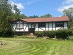 Come enjoy the country living yet close to Route 84. Raised ranch with over 2, 000 square feet containing 3 bedrooms, 2.5 baths on 3 acres in the Minisink School District. Large family room with woodburning stove downstairs, separate laundry room as well as access to the 2-car garage. Lots of storage and 2 new oil tanks installed January 2025. Spacious living room, dining room and eat-in kitchen with access to a large 24&rsquo;x24&rsquo; back deck that leads to a inground swimming pool with a slide. Plenty of room for entertaining!