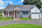 Beautiful and spacious expanded cape in the heart of Merrick. Home features living room, formal dining, kitchen, 4 bedrooms, florida room, 2 full bathrooms, large closets, attached garage, basement with recreation room, inground sprinklers and a nice sized backyard. Above ground pool will remain with home. Close to LIRR, schools and shopping. A must see home!