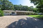 Welcome to this spacious and thoughtfully designed 3-bedroom expanded ranch home, perfectly situated on a quiet cul-de-sac in the desirable Shoreham-Wading River School District. With a split floor plan offering privacy and functionality, this over 2, 000 sq. ft. residence sits on a beautiful lot backing to protected Federal land, creating a serene and private backyard oasis.The primary bedroom wing is set apart for added privacy and features a full en-suite bath, an adjoining office or storage space, and convenient access to the garage.The heart of the home includes a generously sized den with vaulted ceilings and a cozy wood-burning fireplaceâ€”perfect for entertaining or relaxing. The open-concept kitchen (EIK), formal dining room, sitting room, laundry area, and a screened-in sunroom provide excellent flow and versatile living space.On the opposite side of the home, you&rsquo;ll find two comfortable guest bedrooms and a full hall bath.Outdoor living is a true highlight, featuring a welcoming front porch with stone-accented exterior, paving stone walkways and driveway, a shed for extra storage, and a beautiful in-ground pool surrounded by a matching stone patioâ€”offering the ultimate staycation experience.Recent upgrades include a new hot water heater. Home is being sold completely as-is, but all systems are in working order. Don&rsquo;t miss the opportunity to make this expansive ranch your own â€“ with a great layout, tranquil surroundings, and plenty of space inside and out.