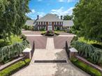 An Iconic Georgian Colonial in Scarsdaleâ€™s Estate Section. This residence is more than just a homeâ€”itâ€™s a legacy property and a sanctuary for those who appreciate the very best in life! This exceptional estate offers an unparalleled lifestyle with resort-style amenities, timeless elegance and unmatched privacy. This exquisite Brick Georgian Colonial, perched at the highest elevation in Scarsdale, has an abundance of sunlight and total seclusion with a custom electric gate and mature lush specimen trees. This exceptional property is located in prestigious Murray Hill, with top-rated schools, in the wealthiest suburb in the United States.Built by a renowned builder as his personal residence, no expense was spared in crafting this one-of-a-kind masterpiece. Set on almost 1.5 acres of meticulously landscaped grounds, the property blends Hollywood grandeur with open-concept living, while still honoring traditional elegance with high ceilings, a show-stopping kitchen, dramatic sunken living room, cathedral ceiling media room and sparkling Strauss & Swarovski chandeliers.The heart of the home is its St. Charles kitchen, featuring custom hand carved cherrywood cabinetry, thick granite counters and a cozy stone fireside lounge. Glass sliders connect to a 250 sq ft flagstone courtyard, ideal for indoor-outdoor living and entertaining.Enjoy year-round water recreation in your own private heated indoor pool with diving board, jacuzzi, refreshment center, spa room, gym, redwood sauna and large steam shower. Every amenity has been thoughtfully curatedâ€”and attention to detail is unsurpassed, from the large Greek dentil moldings, stone fireplaces, oversized windows, hardwood floors (under carpets) to the 9-foot ceilings on every level.This home also features 5 spacious bedrooms, 2 office/flex spaces, 7 full bathrooms, finished lower level with brick fireplace, 2 large attics, spacious grounds for an outdoor pool, tennis/basketball court, or putting green, a driveway for 15 cars leading to a 4 car garage, whole-house generator with automatic switch, 5-zone HVAC and whole house water purification and sound system. No new construction could rival the A+ quality craftsmanship thatâ€™s stood the test of time. Just 20 minutes to New York City or Westchester County Airport, this architectural treasure, is ready to welcome its next lucky homeowner.