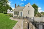Welcome to this modern and meticulously maintained Cape! This home offers a private setting while being conveniently close to trains, buses, shops, restaurants, and major highways. This unique property boasts features that are not typically found in a Cape. Key highlights include a staircase located at the rear of the house, a spacious eat-in kitchen, an inviting entry foyer, and generously sized bedrooms.With newly refinished hardwood floors throughout the first floor, soaring ceilings, and expansive rooms. The bright living room flows seamlessly into the large eat-in kitchen, which is equipped with stainless steel appliances and leads out to a secluded patio. Additional features on the first floor include a full bath and a bedroom currently utilized as a dining room, along with the primary bedroom.The second floor features another primary bedroom complete with an en-suite full bath, and a fourth bedroom. The basement houses laundry facilities, utilities, and provides access to a deep garage that can accommodate two small cars. Enjoy delightful outdoor barbecues on the patio, with two yard spacesâ€”one adjacent to the patio and another on the right side of the houseâ€”both shaded by two awnings over the patio and featuring a level yard. This property is truly a delight to show!