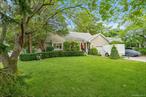 Don&rsquo;t Miss This Charming Babylon Village Home with Expansive, Park-Like Yard!This fabulous, 3-bedroom, 2 full bath home in Babylon Village offers spacious living on a shy half-acre lot. It&rsquo;s ideally located less than 1/3 mile from the LIRR Babylon Station, which is a main hub, making it perfect for commuters who prefer to leave the car at home!Upon arrival, you&rsquo;re greeted by a relaxing front porch, and inside, solid wood floors flow throughout the home. The main floor features a large living room overlooking the porch, a dining room, an eat-in kitchen with white cabinets and sliders to a back deck; as well as access to the Laundry Area and 1.5 car garage with elevated storage. Completing the main floor are the huge family room with wood-burning stove, a wall of windows and a window seat overlooking the park-like yard, two bedrooms and a full bath with a tub.Upstairs, a fabulous extension includes a massive primary bedroom, another very large room (potentially a fourth bedroom, playroom, office, gym, or craft room), and a full bath with both a jetted bathtub and walk-in shower. You will appreciate the easy attic storage access from both rooms upstairs.The amazing yard, with in-ground sprinklers, borders the beautiful Carll&rsquo;s River Watershed, which ensures no future development. The Carll&rsquo;s River Watershed offers access to nature and recreational activities like walks along the stream. Other local parks, a golf course, tennis and pickleball and recreational facilities are also in close proximity. This is your opportunity to enjoy the benefits of a spacious, charming home with a wonderful, expansive yard, in a convenient and highly desirable Babylon Village location. This home is hooked up to sewers, so no cesspools to deal with. The oversized driveway is beautifully covered with pavers and edged with Belgian Block. This Home and Property have so much to offer. Make This Awesome Home YOUR Home Sweet Home in Babylon Village!