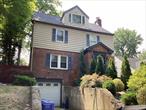 Come see this rare find in the heart of Holliswood! This 4-story detached brick home sits on a 7, 565 sq ft lot and offers 4 spacious bedrooms, 3.5 bathrooms, a finished basement, and a private attached garage with a walk-out driveway that fits 2 cars. First Floor: Features a bright living room, open modern kitchen, dining area, powder room, and access to a private, oversized backyard! Second Floor: Includes a primary bedroom with en-suite bath, two additional bedrooms, and a full bathroom. Third Floor: Offers a large bedroom with a full bath and a walk-in closet. Basement: with a recreation room, laundry area, full bathroom, and direct garage access. Additional highlights include a water filtration system, ductless AC units in each room, a one-year-old roof, a washer/dryer on the main level, and porcelain & hardwood flooring throughout. Enjoy hilltop views, abundant natural light, and convenient access to major highways, shopping, and transportation.