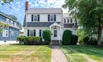 If you have ever had the pleasure of venturing down Kingston Avenue, a lovely tree-lined street on Poughkeepsieâ€™s highly desirable southside, you would have surely been captivated by the stunning curb appeal of this classic period home. A tasteful brick walkway welcomes you.  A beautiful portico, supported by grand pillars, frames the original wood door and the gorgeous transom window above. As you enter, your journey back in time continues. All of the period details have been preserved and immaculately maintained by the original owners. The brick surround fireplace is the focal point of the gracious living room. The living room opens to a generous formal dining room which boasts two charming, corner built-in china cabinets. The kitchen offers loads of solid wood cabinets, a ceramic tile floor and plenty of counter space. There is even a half bath. From the kitchen, enter the fabulous four-season sunroom. There are hardwood floors throughout the home; all in pristine condition. Upstairs, you will discover four spacious bedrooms, great closet space and a large full bath. There is also a huge walk-up attic which offers tons of storage. If you want some additional living space, it could be easily finished. The outdoor space is wonderful. The backyard is level; perfect for a vegetable garden, plantings and outdoor fun. There is a two-car detached garage as well as driveway parking. Conveniently located close to the Poughkeepsie train station, major highways, shopping, dining, hospitals, Vassar College, Marist College and all that the fantastic Hudson Valley has to offer.