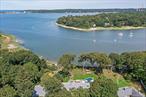 Welcome to Your Private Waterfront Paradise in beautiful and historical hamlet of Strong&rsquo;s Neck Experience a rare opportunity to own a newly renovated 3-bedroom, 2.5-bath wide-line ranch nestled on 1.6 acres of pristine waterfront property with 205&rsquo; of private beach access. The property has sweeping, unobstructed views of both Setauket and Port Jefferson Harbors, this exceptional home offers luxurious living in a serene, natural setting. The home was designed with an open-concept layout, with large windows that flood the living space with light and showcase breathtaking water views from nearly every room. A gated private driveway leads to the home, offering both security and a grand sense of arrival. Enjoy a seamless indoor-outdoor lifestyle: lounge by the in-ground pool overlooking the harbor, host gatherings on the meticulously maintained, level grounds, or relax on your own private beach. For boating enthusiasts, a town-permitted mooring allows you to keep your boat in full view from your backyard. Additional highlights include a finished basement with access to a 2-car garage below, This is more than a homeâ€”itâ€™s a lifestyle. Privacy, beauty, and coastal elegance await. Pictures can not possibly give the true impact of viewing this property in person. Schedule your private showing today! This is more than a homeâ€”itâ€™s a lifestyle. Privacy, beauty, and coastal elegance await. A separate deeded acre that can be kept as a buffer for privacy or future building possibilities is available for an additional purchase.