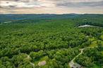 Nestled in Livingston Manor, New York, this expansive 102-acre parcel with 380 feet of frontage offers the perfect blend of tranquility and convenience. Heavily wooded, offering natural beauty and potential for outdoor activities or the perfect setting for creating your own private retreat. A portion of property overlooks Trojan Lake. Principal permitted uses include 1-2 family homes and bed and breakfasts. There is plenty of space for recreational activities such as hiking, camping or wildlife observation. The property provides complete seclusion while being conveniently located near local shops and restaurants.  This could be your serene escape from urban life while staying near conveniences.