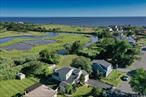 Welcome to 243 South Dunton Avenue, East Patchogue, NYâ€”where charm meets breathtaking views! This custom ranch boasts a newly designed second-story primary ensuite with vaulted ceilings and stunning vistas of The Great South Bay. With 3 to 4 flexible bedrooms and updated bathrooms, the 1, 700 square feet interior is both cozy and modern. Enjoy the lovely summer breezes, or take a short walk to bay beaches and Miramar Playground. Fire Island beaches and local ferries, and bustling Patchogue Town are just a short ride away. The beautifully landscaped property, complete with perennial gardens, adds a cottagey effect reminiscent of a Martha Stewart creation. Plus, the four seasons detached greenhouse is perfect for year-round gardening. New roof in 2021, hot & cold Outdoor Shower, Solid doors throughout, Crawlspace Encapsulation, insulation and humidity control system. This turn-key home is more than a place to liveâ€”it&rsquo;s a lifestyle. Don&rsquo;t miss your chance to own this piece of paradise in East Patchogue!