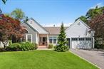 Welcome to 2 Willowood Court, a meticulously maintained and thoughtfully renovated home in the desirable Mill Pond community. Fully transformed inside and out in 2018, this 4-bedroom, 3.5-bath, 3, 126-square-foot residence with hardwood floors throughout offers a bright, open layout that blends functionality with timeless elegance.A formal foyer opens into a spacious main living area that includes a stunning chefâ€™s kitchen equipped with an oversized island, double oven, Wolf stove, gas cooktop, generous pantry, and custom cabinetry by Coastal Cabinet Works of Southampton, offering exceptional storage. The formal dining room features sliding glass doors that lead to a brand-new Massaranduba and Tigerwood entertaining deck with designated dining, grilling, and lounge areas. Flooded with natural light, the adjacent living room centers around a cozy wood-burning fireplace.The private primary suite offers soaring ceilings, a custom-outfitted closet, and an en-suite bath with direct exterior accessâ€”perfect for pet lovers. Two additional bedrooms share a full bath, while a custom powder room and a private office with a closet complete the main level. The attached garage leads directly into a practical mudroom with laundry hookups, ideal for main-level convenience.Downstairs, the legally finished lower level features two expansive living areas, a full-size laundry room with soaking sink and two-year-old machines, and a spacious en-suite bedroom with a cedar closet and full bath and double egress windows that allow for abundant natural lightâ€”an uncommon bonus in lower-level living.The exterior is just as thoughtfully curated, showcasing a newly completed gated front porch, new garage door, and fresh paint. The backyard serves as a true retreat with a vinyl in ground pool, surrounded by mature landscaping and a custom 10x14 storage shed. Located within the Westhampton Beach School District and just down the street from Tennis at the Barn, 2 Willowood Court is a turnkey opportunity to own a truly exceptional home in a sought-after location. ***Dining Room Light Fixture Above Table Does Not Convey***