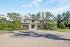 Welcome to your dream homeâ€”an elegant gated 9-room Colonial nestled in one of the most vibrant and sought-after suburban communities. Blending timeless architecture with luxurious modern upgrades, this residence is a true masterpiece inside and out!Step inside to discover expansive living and dining areas, both adorned with custom built-in cabinetry and a charming wood-burning fireplace in the living room. Crystal sliding glass door opens into a dedicated office featuring a built-in desk designed to accommodate two workstations, ideal for remote professionals or creative pursuits.A culinary enthusiastâ€™s paradise awaits including Wolf professional-grade stove, Sub-Zero refrigerator, Marvel wine fridge, Beko hidden dishwasher, High-end Candlelight cabinetry, sleek Cambria countertops, & a 2nd utility sink. Whether you&rsquo;re preparing weekday meals or hosting guests, this kitchen seamlessly combines function and style. Lutron lighting and shade system, as well as a filtered water system throughout the entire house.Your sanctuary awaits in the spacious master bedroom, featuring a cozy gas fireplace and a fully customized Candlelight closet system. The en-suite bathroom offers spa-like luxury with Cambria countertops and rich Candlelight cabinetry.Convenience and elegance continue upstairs with custom cabinetry and a fully equipped laundry room featuring LG washer and dryer units.Entertain in style in your fully finished basement to include: Full bar with Cambria countertops, Marvel refrigerator, beer tap & keg fridge, and Sub-Zero ice machine, Silhouette professional wine cellar (approx. 50-bottle capacity), Glass-enclosed room perfect for a home gym or studio, Built-in Candlelight cabinetry for sleek storageYour outdoor oasis is an entertainerâ€™s dream. The backyard features:â€¢ Built-in XO BBQ stationâ€¢ Marvel outdoor refrigeratorâ€¢ Custom outdoor cabinetry and cooking areaAdjacent to your in-ground pool, the charming pool house includes:â€¢ Marvel refrigeratorâ€¢ Marvel keg fridgeThe storage unit behind the pool house is as large as the pool house! Perfect for summer gatherings or serene evenings by the fire.This exceptional home offers a rare blend of luxury, functionality, and style in a lively, community-focused neighborhood. A must-see for discerning buyers who appreciate quality craftsmanship and effortless indoor-outdoor living. Contact us today to schedule your private tour!