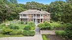 Nestled on a wooded 0.72 acre lot just moments from Hither Hills Beach (beach rights included), 26 Davis Drive in Montauk, NY is a coastal story waiting to unfold. Built in 2001 and beautifully transformed in its most recent renovation, this 4, 200?sq?ft waterfront-inspired retreat now boasts four bedrooms and six baths (five full, one-half), marrying modern design with laid-back seaside living.Imagine arriving at the polished cedar-shingled faÃ§ade framed by mature landscaping, the air scented with salt breeze and garden blossoms. Step inside: an open-concept layout bathed in natural light reveals airy living spaces where wide-plank wood floors meet crisp white walls. The gourmet kitchen, anchored by a generous island and high-end appliances, flows effortlessly into family and dining areasâ€”perfect for entertaining or quiet evenings alike.A narrative of refinement continues upstairs where sumptuous primary and guest suites each feature luxe en-suite bathrooms and serene views over the property. Every bath reflects attention to detail, blending marble, custom cabinetry, and rich fixtures in flawless balance. The layout offers both privacy and shared spaces â€” ideal for families or friends gathering in style.Outside, your private oasis awaits: a beautifully tiled gunite pool nestled in lush green surrounds, offering sunlit serenity by day and starry tranquility by night. A terrace just steps away from the house invites alfresco dining and lounge moments, whether hosting summer barbecues or reflecting under the moonlit sky.Whether as a year round home or treasured seasonal retreat, 26 Davis Drive merges coastal elegance, modern comfort, and Montaukâ€™s unique charm into one unforgettable address.
