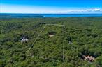 The price listed ($12, 995, 000) is for the Land, Pool, Pool House, and Tennis Court when the house is completely constructed. Right now the Land is separately listed at $3, 295, 000 which includes the Land and the building plans. Perhaps one of the most coveted locations in the Hamptons because of its centrally located positioning amidst the horse and farm fields of Watermill, its proximity to the ocean beach and attractions like yachting in Sag Harbor, golfing in Bridgehampton, and its elevation offering ocean and bay views from the roof deck. Add an extremely rare large piece of property (9 acres) that is adjacent to a conservation easement and surrounded by very large estate-sized parcels with magnificent luxury homes. Plans already exist for a 9000 sf transitional home on four levels with 8 bedrooms and 10 bathrooms, a roof deck for water and sunset views, a large pool, jacuzzi, pool house, and tennis court. The owner of the property offering, Rosewood Developers, is known in the industry as a builder of extremely high quality and distinction - with over 45 years of history building some of the most beautiful and sturdiest homes in the Hamptons and Long Island.