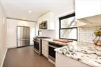 Turn-Key Renovated  Spacious 2-Bedroom in Prime Kew Gardens â€” Just 20 Minutes to the City!Welcome to one of the largest and most unique 2-bedroom homes in the highly sought-after Forest & Gardens community. This beautifully renovated, move-in ready unit is quietly tucked away at the rear of the building, offering a serene and sun-filled retreat â€” your perfect city escape.Enter through a spacious foyer that opens to a bright living room and a separate dining area, ideal for everyday comfort or entertaining. The modern kitchen is a true standout â€” one of the largest youâ€™ll find in co-op living â€” featuring extended granite countertops, abundant custom cabinetry, stainless steel appliances (including a second oven), and an open layout with a bar counter perfect for casual dining or hosting.The king-sized primary bedroom boasts large floor-to-ceiling closets. While the queens-sized second bedroom is equally as spacious with large floor to ceiling closet space â€” perfect as a guest room, home office, or both. Additional highlights include gleaming hardwood floors throughout, excellent closet space, and a thoughtful, functional layout.Forest & Gardens is a gated, pet-friendly community with evening security, a live-in super, laundry room, bike room, private storage, and garage parking (waitlisted). Subletting is permitted after one year. Located just blocks from the LIRR (under 20 minutes to Penn Station), Forest Park, E/F trains, shops, restaurants, and movie theaters â€” with easy access to JFK, LGA, and major highways.This is a rare opportunity to own a true 2-bedroom gem in one of Queensâ€™ most convenient and charming neighborhoods. Donâ€™t miss it!!