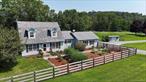 Stunning country cape on 4.76 acres with gorgeous pond and pastoral views. This well-built home features an open floor plan with oak flooring and Pella windows. The spacious kitchen with island has Corian counters and oak cabinets and there is access to a large Trex deck overlooking the pond. The dining area, living room and family room provide ample space for friends and family. A laundry room, full bath and main level bedroom, currently used as an office, complete the main level. The second floor has two guest bedrooms, full bath and primary bedroom with it&rsquo;s own private full bath. The basement is finished with a woodstove, wet bar, second refrigerator and storage room. The property is captivating with a 12&rsquo; deep pond, orchard, organic garden, plus 14x28 outbuilding and separate shed. The 2-car garage provides additional room for vehicles and lots of storage. Don&rsquo;t miss this great country property!