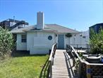 Stylish bungalow with plenty of space! Five bedrooms, two full bathrooms and a huge great room with vaulted ceilings. Perfect summer getaway with excellent rental history bringing in $9k/week! Convenient location to Ocean Bay Park restaurants, ferry and beach! Low carrying costs, taxes only $3, 087 per year!