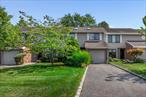 Welcome to Hidden Ponds, a sought-after gated community in Smithtown! Two-story townhouse offers 2 bedrooms, 2.5 bathrooms, and spacious throughout. This home features porcelain tiles, new laminate flooring, and carpeting in the secondary bedrooms. The kitchen is complete with wood cabinetry, granite countertops, stainless steel appliances, and an electric cooktop. The open-concept living/dining room features a cozy fireplace and sliding glass doors leading to a private patio with tranquil pond views. A versatile bonus den provides the perfect space for a home office or guest area. The main level also includes a welcoming foyer, entry to the kitchen, in-unit washer/dryer, and a utility room. Upstairs, a spacious hallway with a bonus loft area leads to secondary bedrooms and a full bathroom. The expansive primary suite boasts a walk-in closet and a luxurious en-suite bath with a shower and jetted soaking tub. Community amenities are second to none, featuring a clubhouse with a shared kitchen, movie/card room, fitness center, heated outdoor pool, tennis/pickleball courts, basketball court, bocce ball, playground, mail room, and plenty of guest parking. Additional highlights: lower-level new windows, new LG refrigerator, new high-efficiency Bosch AC unit (quiet operation), new washer, and a triple-insulated attic. Hidden Ponds truly offers it all!