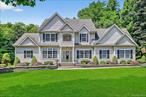 Step into elegance! This exceptional and sophisticated custom home sits on a tree lined street in one of Balmville&rsquo;s most coveted neighborhoods. From the moment you arrive,  you&rsquo;ll be captivated by the lush, professionally landscaped grounds and impeccable curb appeal. Meticulous attention to detail is presented throughout, including a first-floor primary suite with tray ceiling and two walk-in-closets. Primary bath features 2 separate vanities, a walk-in shower and a jetted soaking tub. Entire interior is adorned with high-end finishes, custom mouldings, and stunning hardwood floors. The chefs kitchen is an entertainers dream, featuring double Miele wall ovens, gas cooktop, and abundant storage. Beautiful center island features storage beneath, as well as an automatic downdraft fan. Adjacent to the kitchen you&rsquo;ll find a massive family room with fireplace, which offers the perfect space whether you love casual gatherings, or more formal entertaining...it&rsquo;s all possible here! Upstairs, a large open lofted hallway looks to below, and connects 3 generously sized bedrooms and a home office/playroom. Bonus space above garage offers substantial storage, or room for future expansion! Full walkout basement with full sized windows, generous ceiling height and sliders to back yard. Central air just updated with new compressors and air handlers to keep you cool all summer while your gas fireplace will keep you cozy all winter! Several &rsquo;smart&rsquo; security features for your convenience, whole house water filtration, and extensive sprinkler system for your convenience and peace of mind. This one of a kind rare gem is perfectly situated for an easy commute, moments from I-84, 5 minutes from NYS Thruway as well as the Beacon Metro North train to NYC. Two minutes to vibrant Newburgh waterfront, and easy access to all the Hudson Valley has to offer...from local farms and wineries, to world-class hiking and bike trails. The ideal blend of convenience and tranquility, this immaculate one-owner home is a rare opportunity to enjoy a life of elegance in a premier location. Prepare to fall in love!