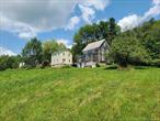 Beautiful farmstead with 23+ acres of property (additional land available) has been in the same family for generations. Includes two vintage handyman farmhouses and multiple outbuildings plus a large rustic barn in need of repair. Land is gorgeous with open meadows, some woods, stone walls and a lovely pastoral view. The homes each offer 3 bedrooms; one has two enclosed porches and a walk-up attic. Room count and SF in listing combines both. One home was built in 1920, the other in 1940; both need lots of elbow grease, however, they are bursting with potential. Zoning is CD â€“ Conservation District - which allows for 3-acre minimum lot size and is intended to protect the sensitive natural areas in the Town of Callicoon from over-development. Located in an extremely beautiful area, this property is perfectly suited for multi-generational living, investment opportunity with two rentals or live in one and rent the other, as well as the perfect getaway. Plenty of open space and usable land for horses, farm animals, gardens, greenhouses, pets and recreation or whatever your agricultural needs may be. Enormous frontage would make it easy to subdivide if desired. Land is fairly level with a gentle slope and there are seasonal views of Stump Pond. Peach trees, rhubarb and concord grapes are just a few of the pleasant farmland surprises. 10+ acres just across the road are also available for sale.