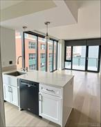 Exceptional Corner One-Bedroom Condo with Floor-to-Ceiling Windows in Prime Long Island CityLocated in the Queensboro Tower, Residence 9C is a rare south-facing corner unit, and one of only two residences in the entire building featuring dramatic floor-to-ceiling windows, flooding the space with natural light and showcasing open city views.This spacious one-bedroom home blends luxury and functionality, just minutes from Manhattan. It boasts an open-concept kitchen with soft-close cabinetry, premium stainless steel appliances, an in-unit LG washer/dryer, and generous closet space. Additional highlights include a private balcony, Nest Thermostat, built-in Bluetooth speakers, and a king-and-queen-sized bedroom with a walk-in closet.Currently tenant-occupied, the unit generates $3, 800/month, lease expiration in August 31, 2026.Residents enjoy contemporary amenities, including a virtual doorman, fingerprint keyless entry, a modern lobby, and elevator access. The building is under a 15-year 421-A tax abatement, with 9 years remaining, offering excellent long-term value.Unbeatable Location & Access:Just one subway stop from Midtown Manhattan and a short walk to Queensboro Plaza and Queens Plaza stations (N, W, 7, R, E, M lines), with easy access to Q32, Q60, Q101, Q102, Q67, Q66, Q39, Q69 buses, and Citi Bike stations.