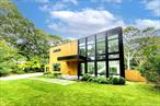 Live the Hamptons dream in this 4-bedroom, 3.5-bath modern masterpiece, set high on a hill for privacy and light. Walls of glass soar two stories high, flooding the open-concept living space and chef&rsquo;s kitchen with sunshine all day long. Host unforgettable summer evenings on the sprawling mahogany deck, or slip away to the private master suite porch for a quiet glass of wine under the stars. Outside, your heated gunite pool, shaded pavilion, and outdoor shower turn every weekend into a resort escape. Perfectly located-just minutes to Georgica and Main Beaches and, of course, East Hampton Village -this home offers the ultimate blend of sleek design, effortless entertaining, and prime location. Move-in ready- just unpack your bags!