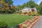 A Rare Offering in the Half Hollow School District â€“ Classic Brick Ranch on 1.29 AcresClassic and timeless, this custom-built solid brick ranch, offered for the first time by its original owners, rests on 1.29 beautifully landscaped acres in the highly sought-after Half Hollow School District. Designed with enduring craftsmanship, the home features 4 bedrooms and 3 full baths, newly replaced central air conditioning, well appointed kitchen with double oven, gleaming hardwood floors, and a striking marble fireplace that serves as the centerpiece of the inviting living room.The walk-out lower level extends the living space with a spacious family room complete with a barâ€”perfect for entertainingâ€”along with a private bedroom, full bath, workshop area, and direct access to a two-car garage. Sun-filled gathering spaces throughout the home offer a warm, welcoming atmosphere, while the expansive grounds invite gardening, outdoor dining, or simply relaxing in the peaceful surroundings.Lovingly maintained and thoughtfully designed, this exceptional property blends quality construction, an ideal location, and abundant possibilitiesâ€”truly a rare find in one of the areaâ€™s most desirable neighborhoods.