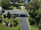 Dream Waterfront Living â€“ 3 Bed, 2 Bath with Expansive Views & Endless PotentialWelcome to this rare waterfront gem nestled on just shy of a half-acre, offering stunning panoramic water views and a lifestyle of peace and possibility. This 3-bedroom, 2-bathroom home features a full basementâ€”perfectly designed for entertaining, hobbies, or future expansion.Enjoy the convenience of a spacious 2-car garage and the beauty of park-like landscaping that frames the property with lush greenery and privacy. Step out back to your private bulkhead and dockâ€”ideal for boating, fishing, or simply soaking in the views.Whether you&rsquo;re looking to settle into a move-in ready retreat or dreaming of expanding and customizing your forever home, this property offers the perfect location and foundation to bring your vision to life.Don&rsquo;t miss this opportunity to own a piece of paradise with endless potential!