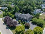 Perfectly situated in the prestigious Village of Flower Hill, this stunning 5-bedroom, 4.5-bathroom brick Colonial is an extraordinary residence that honors tradition while embracing an expansive layout designed for elevated living. Custom built and impeccably maintained, the residence features large formal entertaining spaces with soaring ceilings, oversized windows that bathe the home in natural light, and gleaming hardwood floors throughout.The main level showcases a gracious formal living room and dining room, as well as a dramatic great room anchored by a floor-to-ceiling stone fireplace. The adjacent gourmet eat-in kitchen is a chefâ€™s dream, appointed with bespoke dark wood cabinetry, premium stainless steel appliances, an oversized gas range, limestone flooring and an intricate coffered ceiling. A spacious mudroom with built-in storage and a laundry area connects to the attached two-car garage for added convenience.A versatile first-floor bedroom or private office is accompanied by a full bath - ideal for guests or work-from-home needs. Upstairs, the serene primary suite impresses with cathedral ceilings, a generous walk-in closet, a sitting room and a spa-inspired bath featuring a soaking tub and walk-in shower. Three additional bedrooms and two full bathrooms complete the upper level.The finished walk-out lower level offers flexible living space, including a bonus room and powder room - can be utilized for recreation, fitness, or a playroom. Additional highlights include dual French drain systems, both front and rear staircases, and exceptional storage throughout.Set on beautifully landscaped grounds, the .52 acre exterior boasts mature privacy plantings and an expansive stone patio with a fully equipped outdoor kitchen - ideal for backyard dining and entertaining. Residents of Flower Hill enjoy exclusive access to local preserves and parks with scenic walking trails, sports courts, and playgrounds. Located within the highly regarded Port Washington Union Free School District.