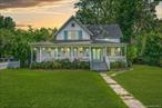 Modernized 1848 farmhouseâ€”known locally as the â€œHulse Houseâ€â€”pairs 19th-century character with todayâ€™s comfort directly across from Setauket Harbor (Three Village SD, taxes just $11, 392). A rebuilt wrap-around veranda frames seasonal water and sunset views; inside, 9-ft ceilings, floor-to-ceiling windows, oak & original wide-plank pine floors, and hand-crafted millwork celebrate the homeâ€™s pedigree.A decorative marble-mantel fireplace accents the front parlor, while the main-floor primary suite enjoys a spa bath with its own Jacuzzi-brand whirlpool tub and custom closets. The 2024 eat-in kitchen offers LG stainless appliances, gas cooking, a breakfast island and timeless wood detailing, opening to formal dining and a window-wrapped sitting room. Upstairs, two character-filled bedrooms share a refreshed full bath that also features a Jacuzzi-brand whirlpool tub.Recent upgrades include 2023 dual-zone natural-gas HVAC with central air, 2022 nitrogen-reducing IA/OWTS septic, updated plumbing, 200-amp service and whole-house 16 kW generatorâ€”historic charm without worry.Stone walks, mature plantings and a detached two-story carriage-house garage grace the one-third-acre corner lot. Stroll to the Village Green, library, harbor parks, Port Jefferson Ferry and Stony Brook Universityâ€”then come home to a piece of Brookhaven history layered with turnkey ease.