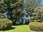LOCATION AND PROPERTY! 1/2 mile DISTANCE TO THE METRO NORTH TRAIN STATION and 1/2 mile DISTANCE TO DESIRABLE KING STREET ELEMENTARY SCHOOL. Special opportunity...first time on the market in 50 years! This classic, center hall colonial, features a wide, front to back entry foyer, original woodwork, hardwood floors and 9 FT ceilings on the main floor. Lovely views directly across the street of scenic, Lyons Park with playground, gazebo and summertime musical performances. The truly special feature here is the oversized lot at .45 acres offering gorgeous mature trees and numerous expansive possibilities in this stunning park-like setting. Step into a grand foyer flanked by a spacious living room, a cozy fireplace and built-in bookshelves. French doors open to a bright sunroom adorned with antique light fixture and the formal dining room located near the kitchen with a breakfast nook. The front-to-back wide hallway leads to the main-level powder room and a charming covered porch that overlooks a private, lush backyard with mature bushes providing natural privacy. Upstairs, youâ€™ll find four well-sized bedrooms, two full baths, and a second sunroomâ€”perfect for a home office, reading nook and/or additional space. Easy access to the attic offers abundant storage space. The house is complete with a full basement, including bonus space. Outside, enjoy the patio, two-car garage and an oversized driveway with plenty of parking. This home is close to local shops and restaurants. This charming home is perfect for hosting large gatherings and offers endless potential. Home is currently heated with oil but is connected to natural gas if a new owner wants to convert. Bring your vision and finishing touches to make it the perfect setting for your next chapter.