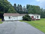 This well maintained 3 bedroom 2 bath mobile home sits on 2.01 cleared acres with a beautiful view. This home features a Primary bedroom with ensuite bathroom with a soaking tub, 2 additional large bedrooms and full bath. Large eat in kitchen leads to the back deck with view of the beautiful back yard. Large living room, laundry hall and converted garage which has been used as a den/bar/entertaining area. Can easily be used as a heated garage again. Beautiful yard with a spectacular view, road frontage and potential!  Shown by appointment only! 90 minutes to NYC.