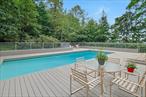 Rare opportunity on coveted secluded road on the grounds of Sleepy Hollow Country Club, one of only a handful of homes. Move right in to this bright Contemporary home with wooded and river views, including an open floor plan and high ceilings. Large living room and family room, each with distinctive fireplaces. Recently redone first floor primary suite with many built ins including a lift for TV at foot of bed, deluxe His & Hers separate marble bathrooms. A second bedroom with ensuite bathroom on first floor. Huge kitchen with sliders to the recently done Trex deck and pool with an auto cover. Features a large laundry room and full bathroom with a door to the deck/pool; thereâ€™s even an outdoor shower! Convenient attached two car garage. Lower level walk out to deck and yard with playroom and wet bar with a third fireplace. Office and two additional bedrooms, lots of storage. Large separate storage shed is conveniently off the main driveway to the home. Situated on .94 of an acre.