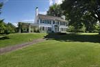 Westerly is one of the finest estates on Quaker Hill, located on 23.77 private, level acres, all cleared & landscaped, at the end of a truly local road. The expansive fields & meadows are perfect for a horse farm. The original home was built in 1860, the front addition was built in 1920 by the DeWitt-Wallaces of Readers Digest fame. A sensitive whole house renovation was completed in 1990 preserving the original character of the home with modern upgrades for ones comfort & enjoyment. The home itself is magical with over sized rooms which flow into one another for an open feeling. A wide, two story foyer with elegant winding staircase leads to the upstairs. A spacious LR w/fplc, a library with built in bookshelves & a fplc, an office, a formal DR w/ fplc, a designer eat in kitchen w/granite counters, a dining area & the original wood burning stove still installed in a fireplace,  (not usable but left as a historical reminder). The back staircase leads to the upstairs. The entire house has hardwood floors. There are French doors everywhere & the windows are tall to let in the beautiful sunlight. Upstairs, 6 BR&rsquo;s, 4 full bathrooms. Downstairs, 2 powder rooms. There is a recreation/pool room & a mud room with built ins. The covered veranda offers shade & a lovely place for those lazy afternoon lunches & early evening sun downers. The patio off the LR offers an additional outdoor space to relax. There is a caretakers cottage with a 3 car garage & a 2 stall stable with tack room. There is also a large 3 bay barn towards the back of the property, a har-tru tennis court in need of repair & a basketball court. The in ground pool which hasn&rsquo;t been used in years is below the main house, privately situated alongside a stream. There is a fabulous gazebo overlooking the stream which was used for a writers studio & also as changing rooms. The property is minutes from the village of Pawling, the train station, shops, places of worship, restaurants & the Saturday morning farmers market from June through September. Only 90 minutes from NYC, it is an easy commute either by train or car.