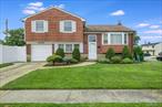 Beautiful Split-Level Home on a Prime Corner Lot in Hicksville!Welcome to this exquisitely maintained 4-bedroom, 2.5 bathroom split-level home nestled on a gorgeous corner property in one of Hicksville&rsquo;s most convenient locations. Close to schools, shopping, restaurants, the library, and the Long Island Railroad-everything you need is just minutes away!Home Features Include: spacious and bright split-level layout, beautiful wood floors under most carpeting, 4 generous bedrooms and 2.5 bathrooms, roof replaced just 5 years ago, 3 efficient wall A/C units, separate hot water heater, 200 amp electric service, above-ground oil tank, generator hookup for peace of mind, in-ground sprinkler system for easy lawn maintenance, gorgeous new vinyl fencing for privacy and curb appeal. This is the perfect opportunity to own a well-loved home in a sought-after location. Move-in ready and full of potential! Don&rsquo;t miss it!