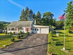Picture yourself stepping into a postcard-perfect scene where you will relish in the charm of a lovingly maintained 1950â€™s Cape style home nestled in one of Warwick Villageâ€™s most sought-after neighborhoods. Those who know, know - for those who donâ€™t know - The Village of Warwick exudes historic curb appeal, idyllic village homes, and a serene Village-inspired ambiance that might just transport you to a peaceful, Mayberry-like setting. Enjoy a leisurely stroll to the Village of Warwickâ€™s many cafes, restaurants, shops, seasonal farmerâ€™s market (notably one of the finest),  historic sites, award-winning library, and summer concerts - fostering a true small-town feel. Stop imagining it and live it while making your own memories in this 3 bedroom, 2 bath home perfectly set on nearly half an acre of park-like property that invites you to slow down and savor natureâ€™s beauty. Whether you&rsquo;re sipping coffee in the morning sun or hosting friends for an evening under the stars, this property is a true sanctuary where watching butterflies and birds flutter through your pollinator-friendly gardens will become your favorite past time. Inside youâ€™ll find timeless character with comfortable living spaces, hardwood floors, first floor bedrooms and baths, a vintage inspired kitchen with eating space, ample counter and cabinet space, a living / dining room for comfortable conversation and gatherings, plus an upstairs bedroom ready to make your own. This is more than just a home, itâ€™s a lifestyle that combines timeless character and the convenience of Village living. Donâ€™t miss this rare opportunity to own a piece of Warwickâ€™s storybook charm. Call today to schedule a private tour.