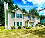 BETTER THAN NEW!  SPACIOUS 4-Bedroom, 3-Full Bath Bi-Level ColonialWelcome to this meticulously maintained home offering over 2, 700 sq ft of beautifully finished living space that blends modern style with timeless charm.Step into the gorgeous eat-in kitchen, thoughtfully designed with:A large center island with ample seatingGleaming hardwood floorsVaulted ceilings that create a bright, open feelCustom cabinetrySliding glass doors leading to a sun-filled deckâ€”perfect for outdoor dining and entertainingThe sun-drenched living room features dramatic cathedral ceilings and a wood-burning fireplace, adding character and warmth. Hardwood flooring flows seamlessly throughout the living room, kitchen, hallway, and stairs, adding elegance at every turn.Enjoy three fully tiled, well-maintained bathrooms, including a luxurious primary suite complete with:Tray ceilingRecessed lightingWalk-in closetA spa-inspired ensuite bath with stand-up shower and jacuzzi tubThe lower level offers incredible additional living space with:A large family roomFourth bedroomFull bathroomLaundry roomWalkout access to a paver stone patio overlooking your private, landscaped yardAdditional Features Include:Recessed lighting throughoutSpacious 2-car attached garageMove-in ready condition that reflects pride of ownershipThis home offers comfort, space, and styleâ€”ideal for both everyday living and entertaining. A true gem that lives like new!Location Perks:Close to SUNY Orange (OCCC), Garnet Health Medical Center (ORMC), shopping, restaurants, major highways, and the train stationâ€”everything you need within easy reach!Don&rsquo;t let this one get away! Make your appointment soon!