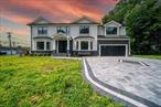 Stunning New Construction Colonial in Syosset! This exceptional 5-bedroom, 3.5-bathroom home features elegant stucco siding and high-end finishes throughout. The thoughtfully designed layout creates a seamless flow between living spaces, with spacious bedrooms and elegantly appointed bathrooms that reflect superior craftsmanship. Situated in highly sought-after Syosset with its top-rated school district, this beautiful home offers luxury living in one of Long Island&rsquo;s most coveted communities. The convenient 2-car garage provides added functionality, while the full unfinished basement offers endless potential for a home office, recreation room, gym, or guest suite. Don&rsquo;t miss this opportunity to make this exceptional new construction home yours!