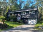 Lovely 3-4 bedroom home located in a quiet, friendly neighborhood, just minutes from the shopping, dining, and arts in the village of Woodstock, and about 15 minutes to bustling Kingston and Saugerties. 12 minutes to Thruway, 15 minutes to Trailways bus in Kingston (5 minutes to Woodstock stop), 25 minutes to Rhinecliff Amtrak train station for car-free access to NYC. Upstairs you&rsquo;ll find 3 beds, 1.5 baths and an open kitchen/living/dining with beautifully refinished oak floors and a picture window, plus some updated premium lighting and fixtures. A lime-washed fireplace with woodstove insert will keep you cozy in the winter. There is a spacious kitchen with modern appliances, plenty of storage, gorgeous Silestone counters, a deep double-basin quartz sink, stylish acrylic hardware, designer porcelain tile floors, and an elevated subway tile backsplash made from imported Spanish tiles.The downstairs has a cozy den/TV room as well as a king-size room which could also be a home gym, office, music space, or family room. Also, there is a semi-finished laundry room with new (-1 year old) front-load, high-efficiency, high-capacity GE washer/dryer & built-in storage cabinets. Freshly painted with low VOC paint throughout the home.Outside you&rsquo;ll enjoy a spacious cedarwood deck (2 years old) for dining, entertaining, and relaxing. Or step down to a large, artisan blue stone patio with solar string lights. There is a pollinator-friendly, biodiverse yard full of ferns, clover, plantain, herbaceous plants, little flowers, rock out-croppings, mosses, and trees. Plus, a giant butterfly bush to welcome you to the front door, lush ferns, and young forsythia, rhododendron, and bleeding hearts. Attached garage can fit a car + motorcycle, or car and storage/workspace. The driveway can fit 4 - 5 cars. Come check out this home that has had many updates in the last 2 years, including a new roof and gutters, new boiler, new on-demand hot water heater and upgraded 200amp electric panel with a generator switch.