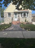 Nestled in the charming community of Floral Park, this inviting Cape Cod home offers 4 bedrooms and 3 full bathrooms, blending classic design with modern comfort. The property features a detached one-car garage and a beautifully finished full basement with a separate entrance, perfect for a guest suite, home office, or recreational space. It has new windows, new roof. With its timeless curb appeal, functional layout, and prime location close to schools, parks, and transportation, this home is an ideal choice for comfortable living and versatile use.