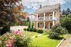 Historic Village Gem with Timeless Charm near Metro-NorthIn the heart of Wappingers Falls, near Meiser Park, stands a home with grace, history, and room to welcome all. Thoughtfully cared for over the years, this residence offers space and versatility thatâ€™s perfect for anyone seeking a home with character and flow - not to mention easy access to NYC via the New Hamburg Metro-North station. A wide, covered front porch invites you inside, where the foyer opens to a large living room and formal dining room. Two bedrooms on the first floor, although one is definitely ideal as a nursery or office, share a beautifully updated Jack-and-Jill bath with radiant heated floors. The first floor kitchen is spacious with direct access to the charming backyard.The second and third floors offer the possibility of another living quarter for guests or extended family (check with town for your specific usage requirements). The dedicated entrance opens into a generous living area, a bedroom with walk-in closet, a kitchenette, dining alcove, full bath - and a covered veranda extends the living space outdoors, complete with ceiling fan and room for lounging in the fresh air. The finished attic space above has two spacious two bonus rooms alongside a full spa bath. The finished basement offers even more possibilities, with a large open area to make your own, as well as a separate laundry room.The backyard provides a tranquil retreat, all within a short stroll to some of hopefully your soon to be local favorites such as Normaâ€™s, Casa Ortega, Cafe Con Leche, day&nite lounge, and more.  This home is a rare gem in a storied neighborhood, offering history, comfort, and timeless charm in equal measure.