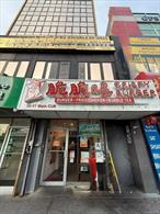 Prime investment opportunity in the heart of Flushing! Unit CU8 is a street-level commercial condo located on the iconic Main Street. Boasting 935 square feet of usable interior space, the property is currently leased to a long-term, stable food service tenant (fried chicken) with monthly rent of $10, 300. Lease runs through the second half of 2026. Tenant is responsible for interior maintenance The landlord currently pays $24, 000 annually towards property taxes; the tenant covers any overage. Located in a mixed-use elevator building, steps from the 7 train, Skyview Mall, and major transit lines. High foot traffic, excellent visibility, and strong retail synergy make this unit a rare find for investors or 1031 exchange buyers.