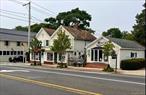 Investment opportunity! Two story frame building with two retail stores on the first floor and two apartments on the second floor. One story frame retail store with private parking lot.