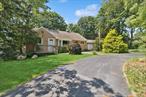 Beautiful 3-bedroom ranch set on a private and expansive 0.75-acre lot in Ronkonkoma. This inviting home features hardwood floors throughout and a sunlit living room highlighted by a stunning bay window. The full bathroom is elegantly finished with floor-to-ceiling tile, and the eat-in kitchen offers granite countertops, tall ceiling cabinetry, and a pantry for ample storage.The dining roomâ€™s sliding glass door opens to a spacious deckâ€”perfect for morning coffee or evening gatherings. A washer and dryer hookup is conveniently located in one of the bedrooms.Outdoors, a charming paver walkway leads you to an oversized 2-car garage and a sprawling horseshoe and traditional driveway, offering abundant parking. The fully fenced backyard includes a large paver patio ideal for entertaining. Additional highlights include central air conditioning and a fully finished basement providing versatile space for recreation or storage.This Ronkonkoma gem truly has it all!