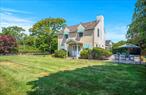 Located in the estate section of Quogue Village, this beautifully maintained home offers comfort, convenience, and classic Hamptons living. Enter through charming gates to a spacious, manicured lawn with mature landscaping. A free-form heated gunite pool is the centerpiece of the backyard, surrounded by a brick patio ideal for relaxing or entertaining. Inside, the cozy living room features built-in bookcases and a wood burning fireplace, creating a welcoming atmosphere. The open kitchen includes a generously sized breakfast bar and dining area, designed for both everyday living and hosting. The first-floor primary suite overlooks the garden and features a large bathroom with a double vanity and separate shower. A guest bedroom, full bath, laundry area, and attached garage complete the main level. The second floor hosts 2 generously sized guest bedrooms that share a hall bath. Low Quogue taxes further enhance the home&rsquo;s appeal. Located less than .25+/- miles from local shops, the community theater, Schmidt&rsquo;s Market, and the Jitney stop, this Quogue gem is not to be missed. Property owners have access to the Quogue Village Beach.