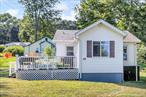 This quaint two-bedroom home is located in the lake region of Monroe. It is a short walk down Heaton rd. to Walton Lake. There is an enclosed porch when you enter the home that has bright sunny windows. The kitchen and living room are one open room. There is one bathroom, both bedrooms have nice size closets. Full attic with pull down stairs for storage. Great starter home or perfect for downsizing or summer home. Low taxes